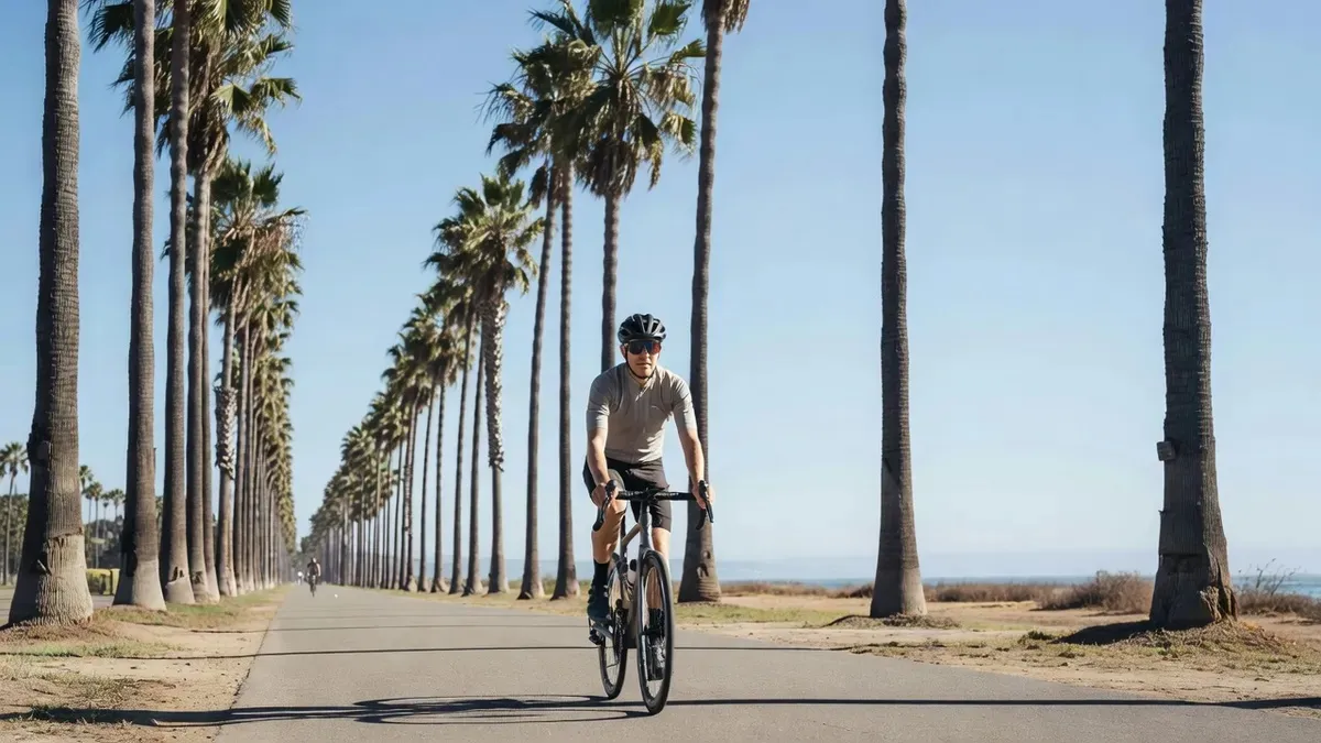 Cyclist on an electric bike along the Cabrillo bike path in Santa Barbara with the Pacific Ocean and Channel Islands in the background, santa barbara electric bike tours along the waterfront